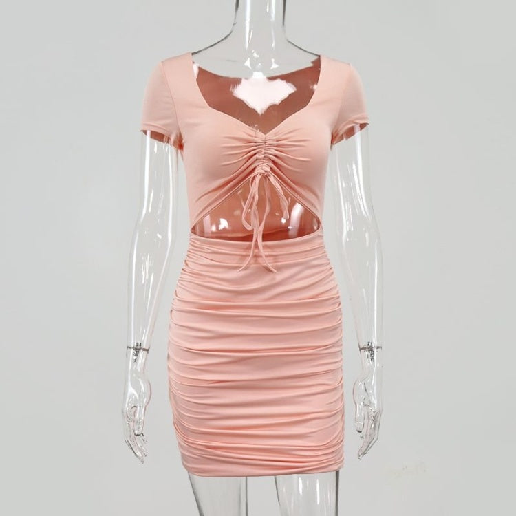 Pink ruched dress on a mannequin against a gray background