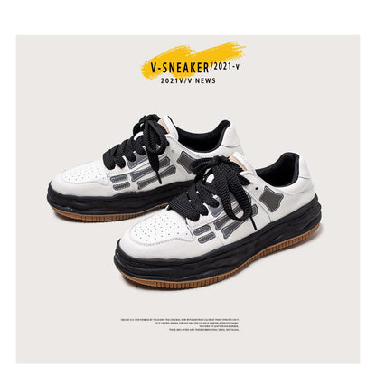 White sneakers with black accents on a light gray background, featuring 'V-SNEAKER/2021-V' text.