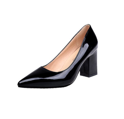 Black patent leather high heel shoe on a white background