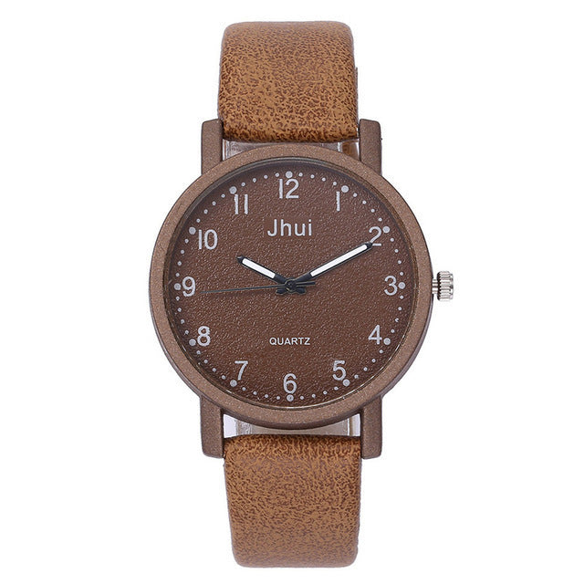 Brown wristwatch with leather strap on a white background