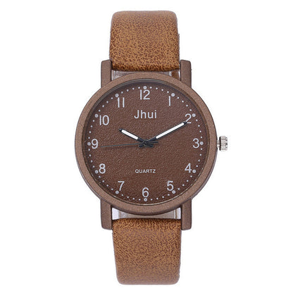 Brown wristwatch with leather strap on a white background