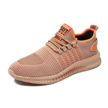 Beige sneaker with orange accents on a white background