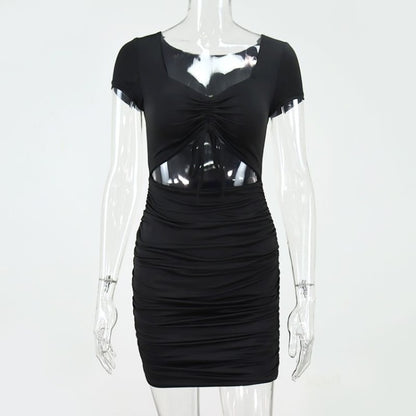 Black dress with sheer panels on a mannequin against a white background