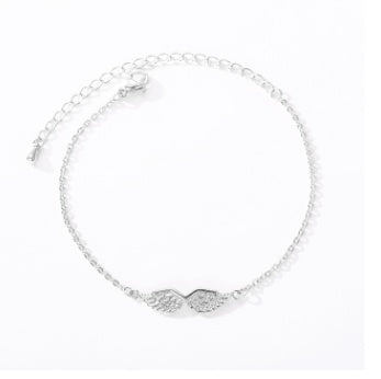 Silver bracelet with a subtle design on a white background