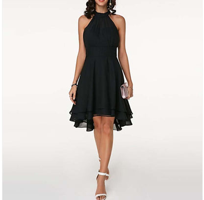 Black halter neck dress worn by a model on a white background