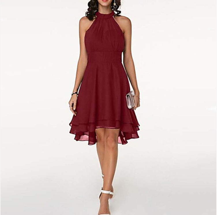 Red halter neck dress worn by a model on a white background