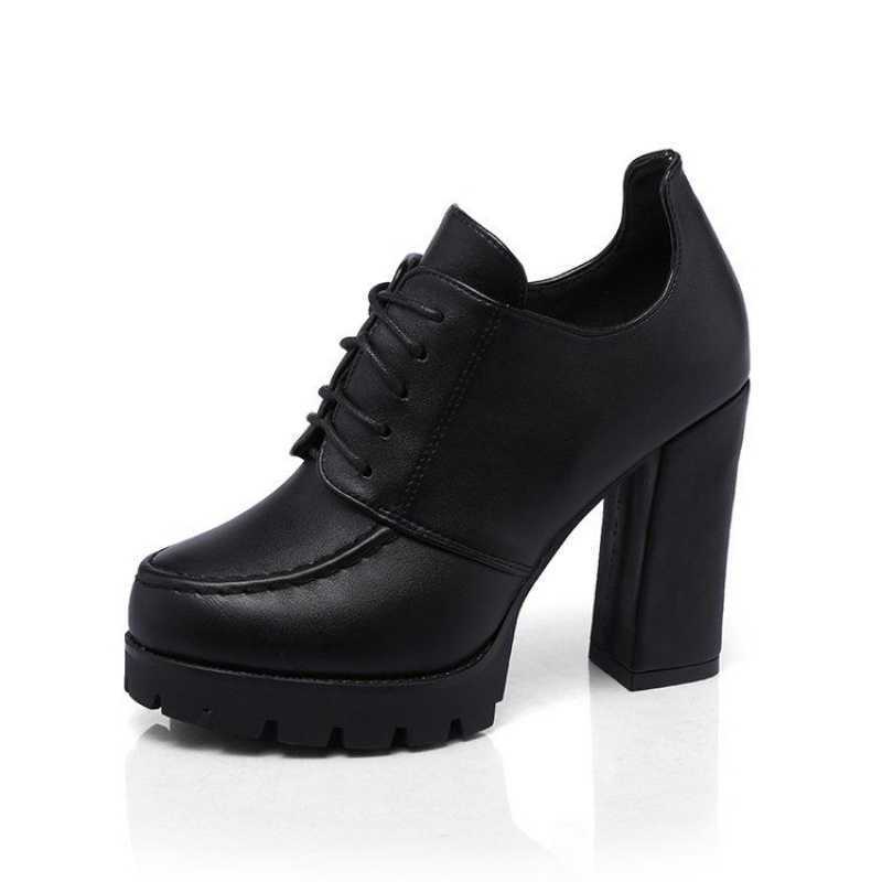 Black platform shoe on a white background