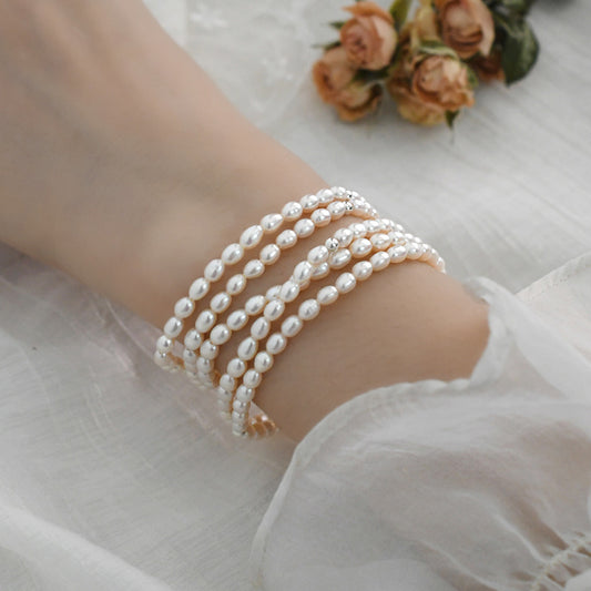 Pearl bracelet on a wrist with a soft background
