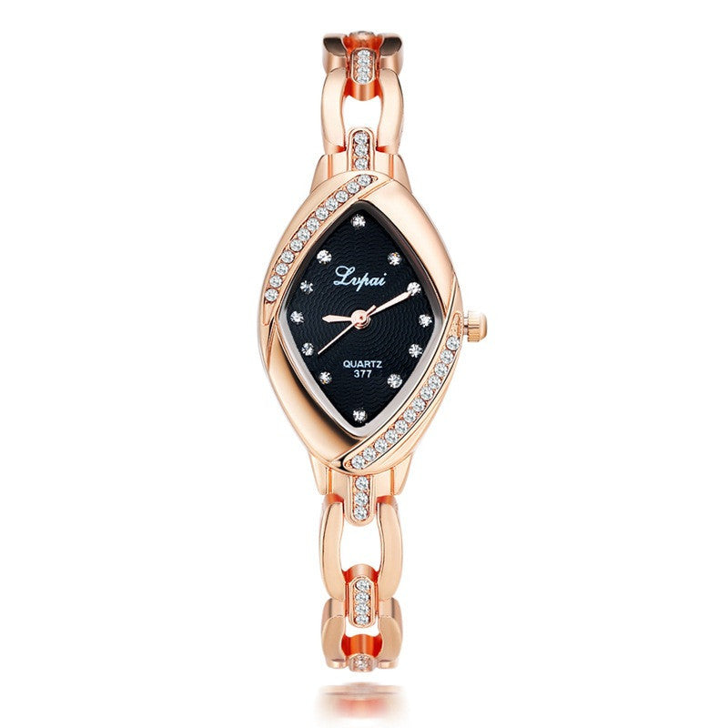 Rose gold watch with black dial on a white background