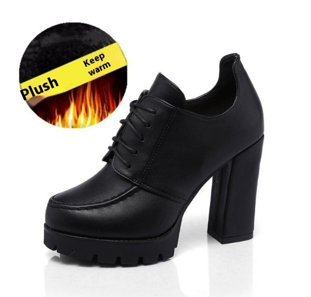 Black high-heeled shoes with plush lining feature on a white background