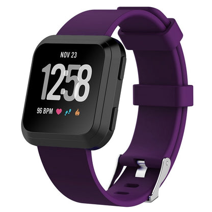 Smartwatch with a purple band on a white background