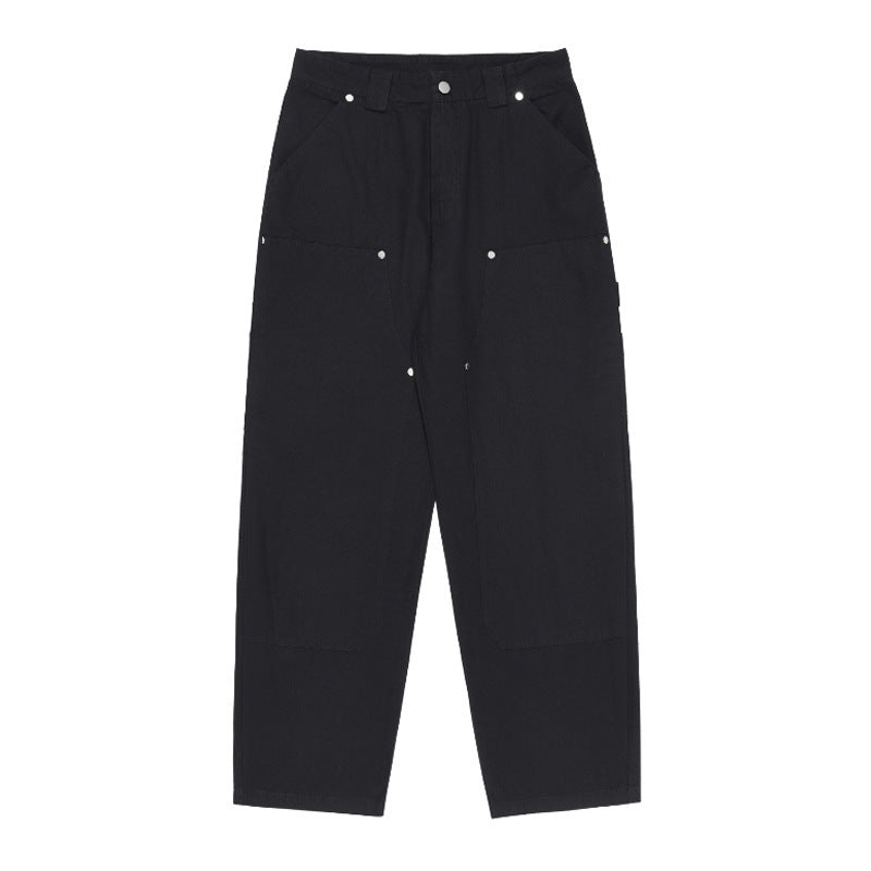 Black pants with button details on a white background