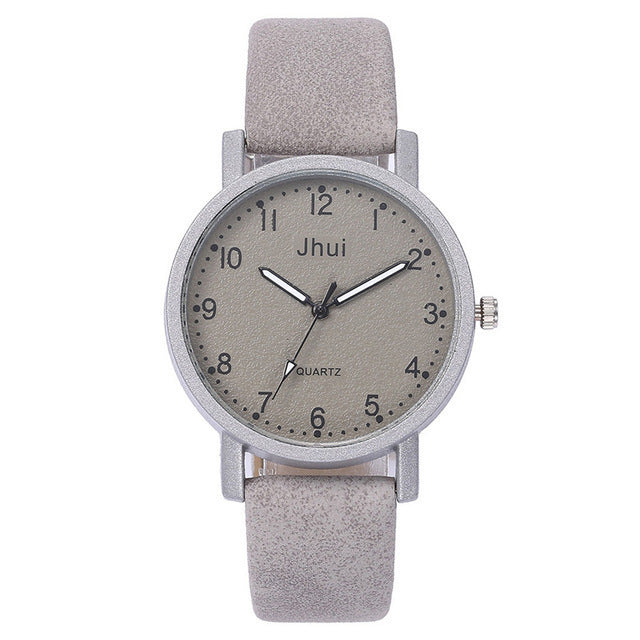Gray wristwatch with a matching strap on a white background