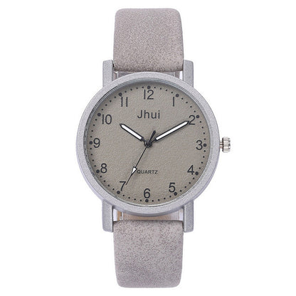 Gray wristwatch with a matching strap on a white background