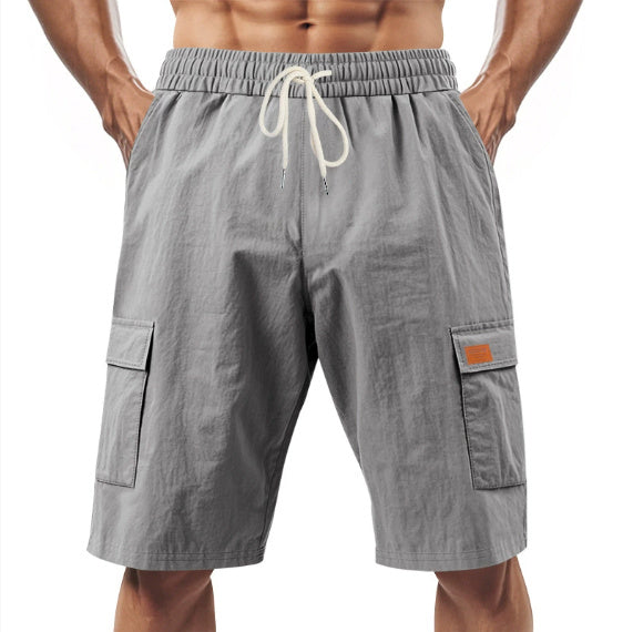 Gray cargo shorts with a drawstring on a white background