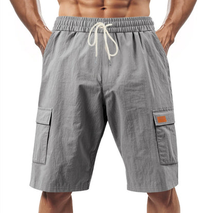 Gray cargo shorts with a drawstring on a white background