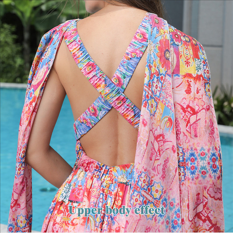 Colorful floral dress with open back worn by a person, poolside.