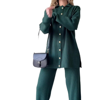 Person wearing a green ribbed outfit with a matching handbag on a white background