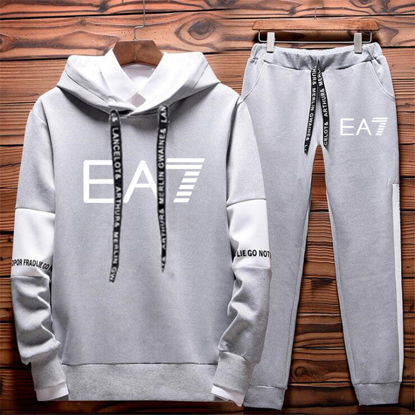 Hoodie and parts set with EA7 branding on the background