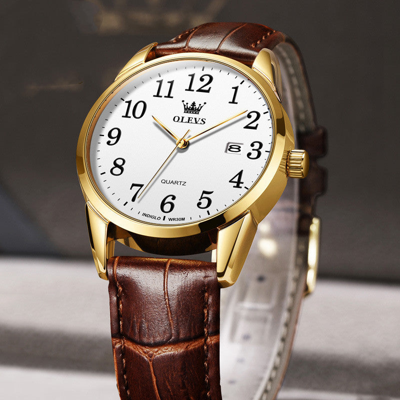 Gold watch with a brown leather strap on a gray background