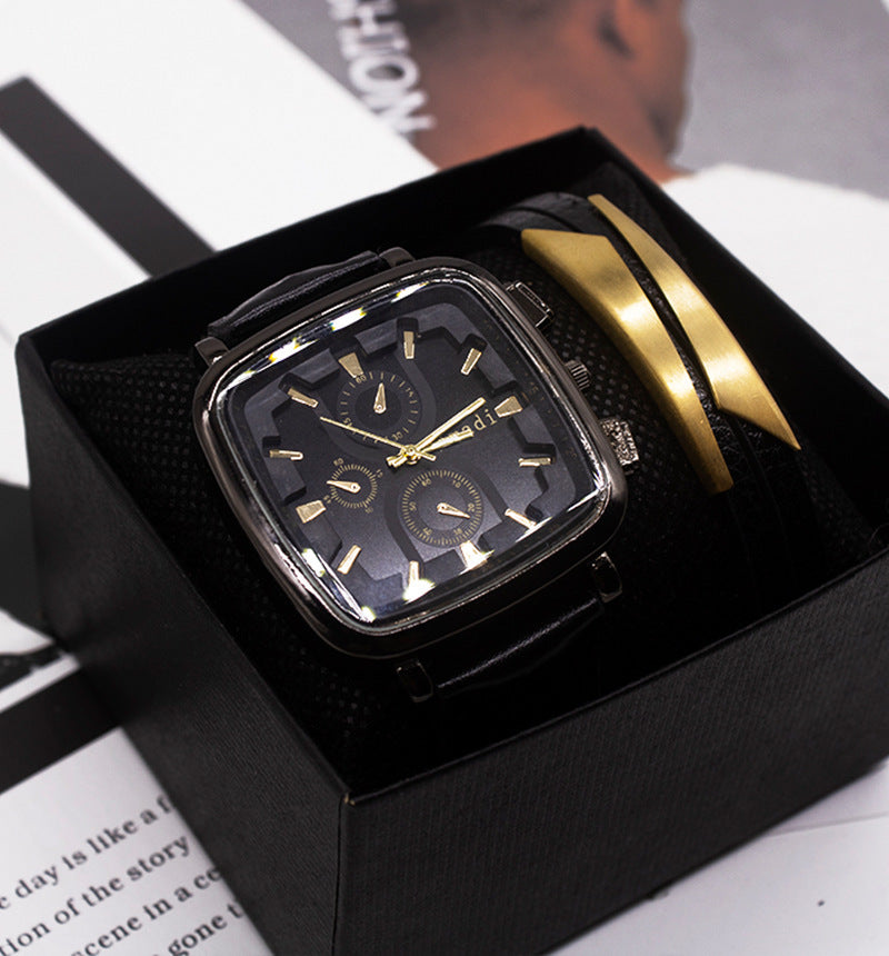 Luxury watch with gold accents in a black box on a magazine background