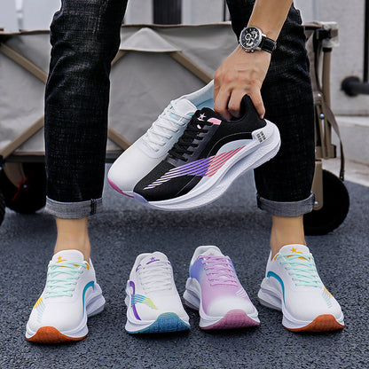 Person holding a black and white sneaker with colorful accents, surrounded by four other sneakers on a dark surface.