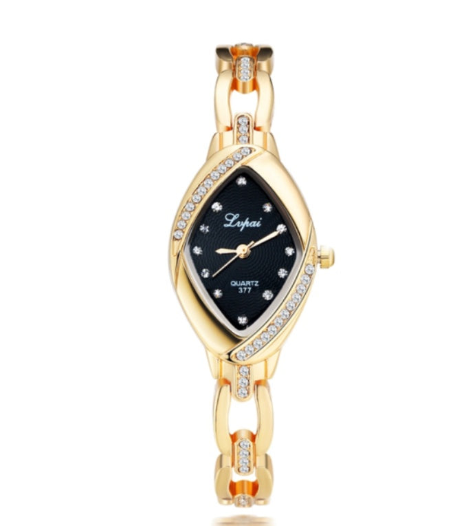 Gold wristwatch with black dial on a white background