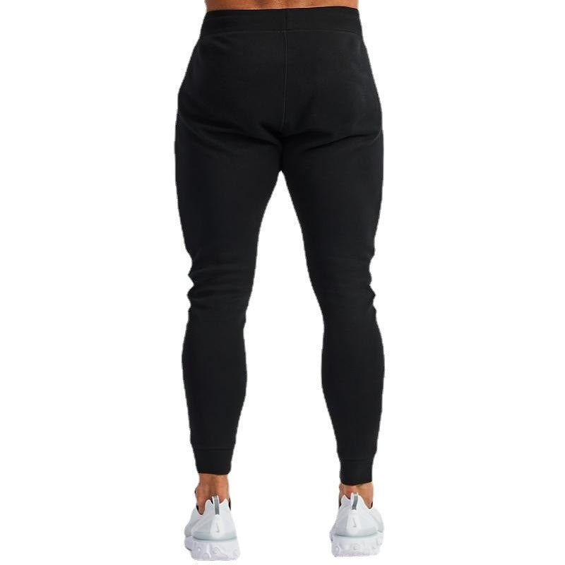 Black leggings worn by a person on a white background