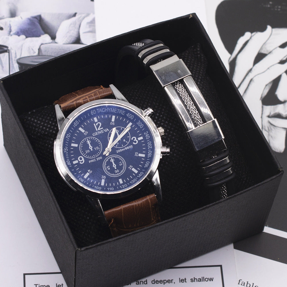 Watch and bracelet set in a black box with a blue dial watch on a white background