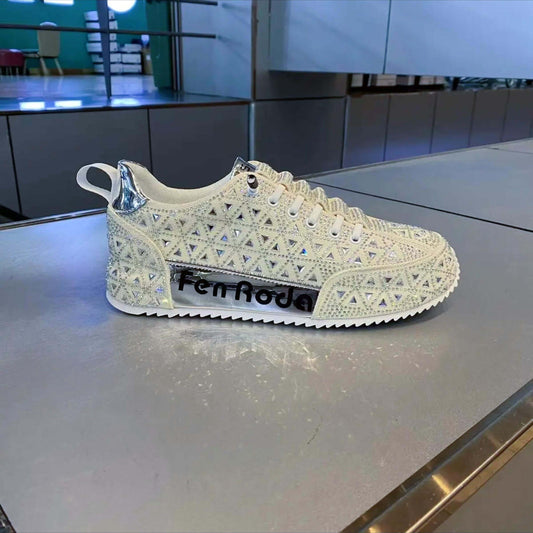 Decorative sneaker with intricate design on a reflective surface
