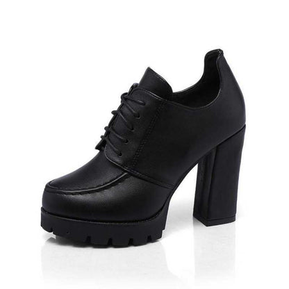 Black platform shoe on a white background