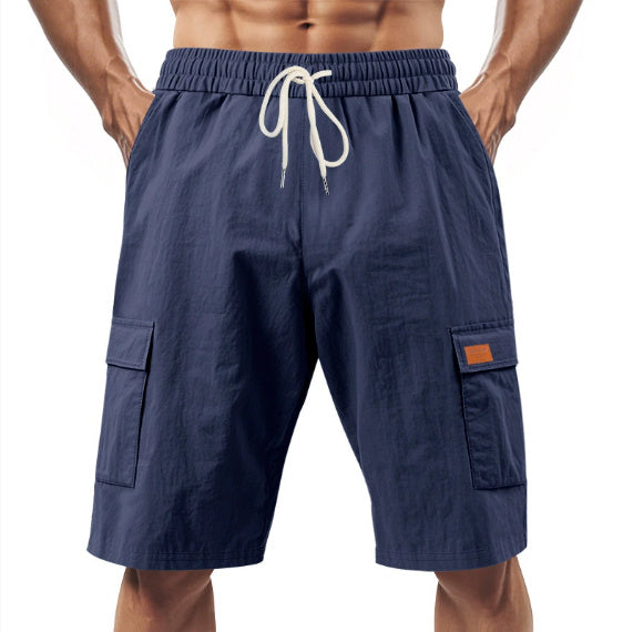Navy blue cargo shorts with a drawstring on a white background