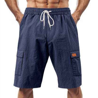 Navy blue cargo shorts with a drawstring on a white background
