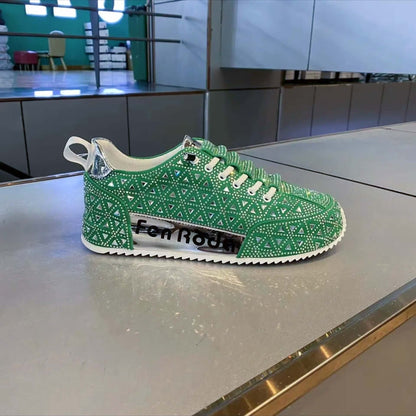 Green sneaker with rhinestone pattern on a metallic surface, brand 'Fen Rode' visible.