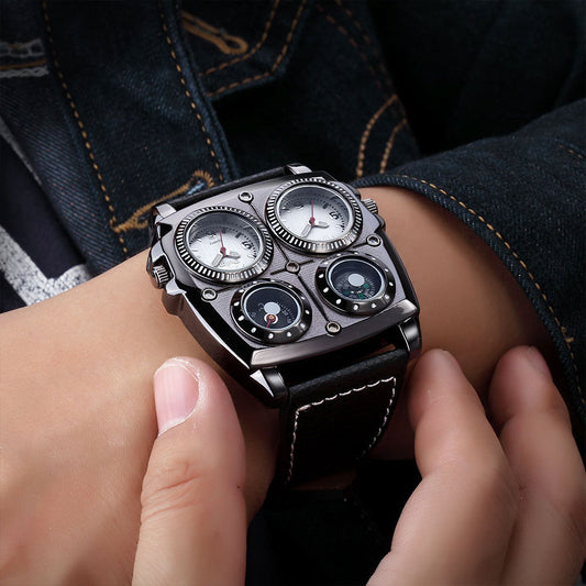 Close-up of a person wearing a detailed wristwatch with a black leather strap.