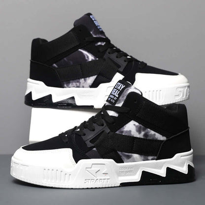 Black and white sneakers with a gray background