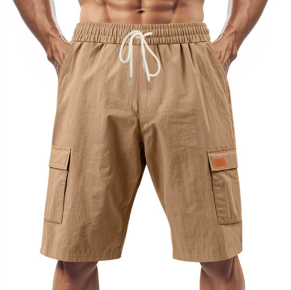 Beige cargo shorts with a drawstring on a white background