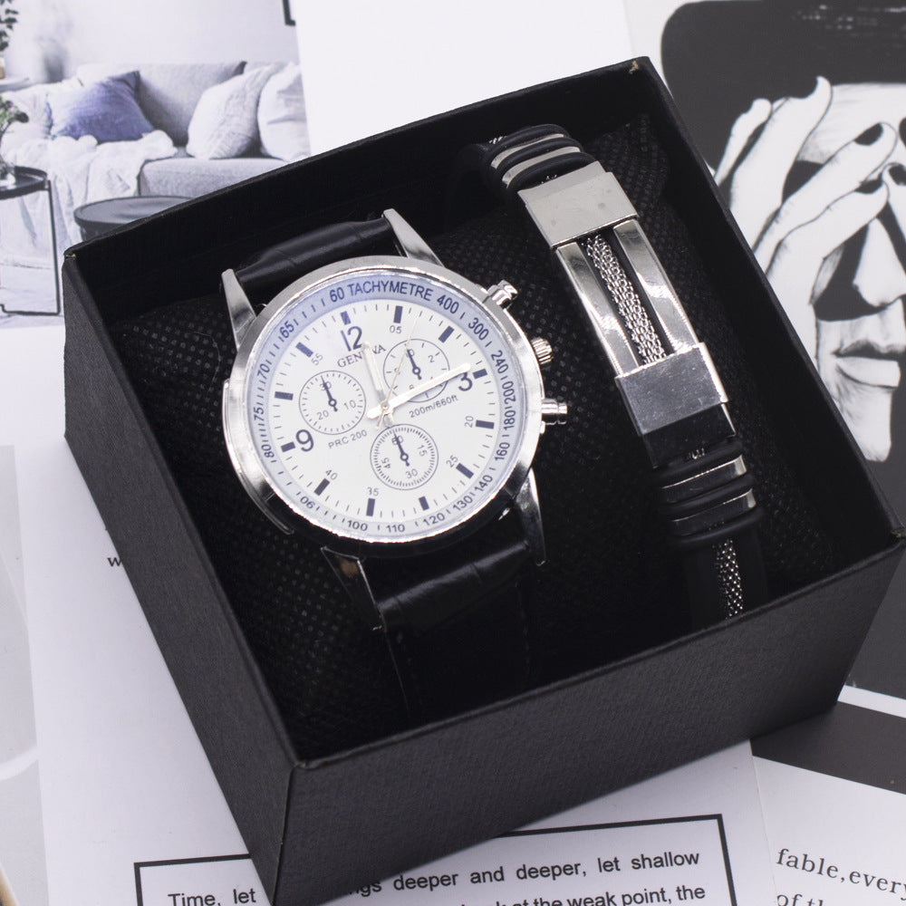 Wristwatch with black strap and silver case in a black box on a magazine background