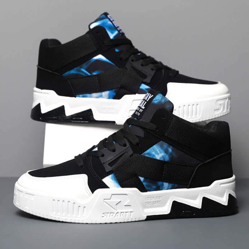 Black and white high-top sneakers with blue accents on a gray background