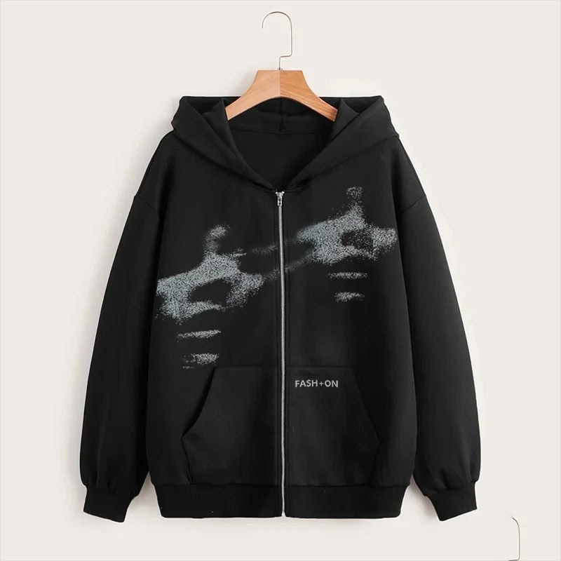Black hoodie with a graphic design on a hanger against a white background