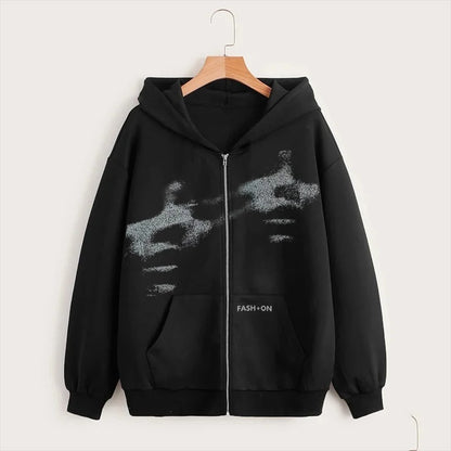 Black hoodie with a graphic design on a hanger against a white background